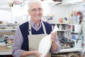 Portrait Of Senior Man Holding Vase In Pottery Studio Royalty Free Stock Photo