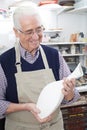 Senior Man Holding Vase In Pottery Studio Royalty Free Stock Photo