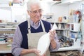 Senior Man Holding Vase In Pottery Studio Royalty Free Stock Photo