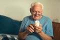 Senior Man At Home Taking Medication Royalty Free Stock Photo