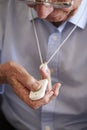 Senior Man At Home Using Distress Alarm Call Button Royalty Free Stock Photo