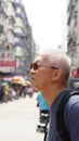 Senior man with hong kong urban architecture scene Royalty Free Stock Photo