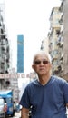 Senior man with hong kong urban architecture scene Royalty Free Stock Photo