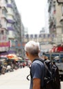 Senior man with hong kong urban architecture scene Royalty Free Stock Photo