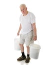 Senior Man Hunched Carrying Buckets Royalty Free Stock Photo