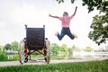 Senior Man Jumping Up From Wheelchair Royalty Free Stock Photo