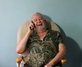 Senior man laughing on mobile cell phone. Royalty Free Stock Photo