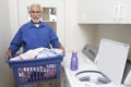 Senior Man With Laundry Basket Royalty Free Stock Photo