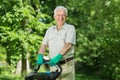 Senior man with lawn mower Royalty Free Stock Photo