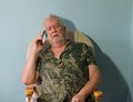 Senior man listening on mobile cell phone. Royalty Free Stock Photo
