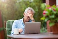 Senior man looking stressed while working on laptop Royalty Free Stock Photo