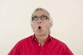 Senior man looking surprised upwards Royalty Free Stock Photo