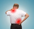 Senior man with lower and upper back pain Royalty Free Stock Photo
