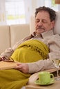 Senior man sleeping in armchair Royalty Free Stock Photo
