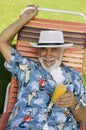 Senior Man lying on lawn chair