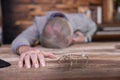 Senior man lying unconcious on office table suffer from heart attack Royalty Free Stock Photo