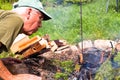 Senior man making bonfire Royalty Free Stock Photo