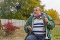 Senior man making faces while doing selfie outdoor Royalty Free Stock Photo