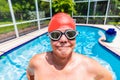 Senior man wearing swimming cap and goggles Royalty Free Stock Photo