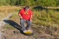 Senior man man fishing in ancient basin thinking he is still a kid