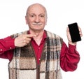 Senior man with mobile phone posing in studio Royalty Free Stock Photo