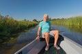 Senior man in motor boat Royalty Free Stock Photo