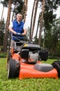 Senior man mowing the lawn. Royalty Free Stock Photo
