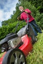 Senior man mowing the lawn Royalty Free Stock Photo