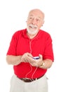Senior Man with MP3 Player Royalty Free Stock Photo