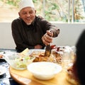 Senior man, muslim and table with food for eid or ramadan for religion to enjoy and satisfied at home. Faith, Islam and Royalty Free Stock Photo