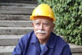 Senior man with a mustache doing construction work Royalty Free Stock Photo