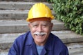 Senior man with a mustache doing construction work Royalty Free Stock Photo