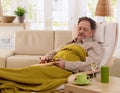 Senior man napping in armchair Royalty Free Stock Photo