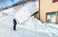 Senior Man near entrance of the house hidden under the snow Royalty Free Stock Photo