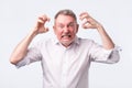 Senior man with nervous crisis. He is in fury Royalty Free Stock Photo