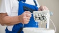 Senior man painting a room of rental appartment Royalty Free Stock Photo