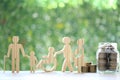 Senior man and people on wheelchairs.pregnant woman with stack of coins money in glass bottle on natural green background, Save Royalty Free Stock Photo