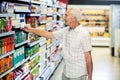 Senior man picking canned food Royalty Free Stock Photo