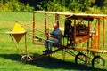 A senior man pilots an antique Curtis Pusher Model D