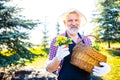 Senior man planting a plants in garden outdoors spring season ready Royalty Free Stock Photo