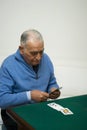 Senior man playing cards Royalty Free Stock Photo