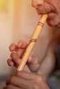 senior man playing the flute. faceless unprofessional male of elderly caucasian recorder