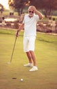 Senior man playing golf alone Royalty Free Stock Photo