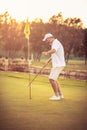 Senior man playing golf alone.  I am the best Royalty Free Stock Photo