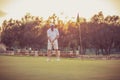 Senior man playing golf alone.  Simply enjoys golf Royalty Free Stock Photo