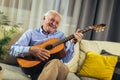 Senior man playing guitar Royalty Free Stock Photo