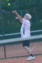 Senior man playing tennis Royalty Free Stock Photo