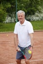 Senior man playing tennis Royalty Free Stock Photo