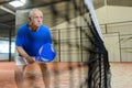 Senior man playing tennis Royalty Free Stock Photo