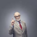 Senior man points finger up Royalty Free Stock Photo